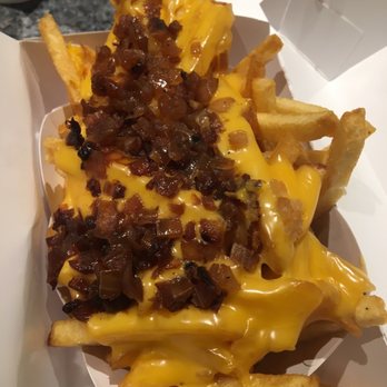 In-N-Out Burger - Fries with grilled onions and cheese on top - Fast Food Near Me - Upland, California In-N-Out Burger - Fries with grilled onions and cheese on top - Fast Food Near Me - Upland, California