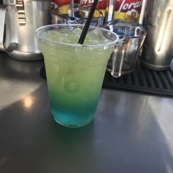 The Sports Buzz - a green drink with a straw - Coffee & Tea Near Me - Darrington, Washington The Sports Buzz - a green drink with a straw - Coffee & Tea Near Me - Darrington, Washington