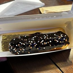 Chocolate eclair with chocolate cream filling. clair Chocolate Chocolate eclair with chocolate cream filling. clair Chocolate