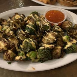 Bang bang brussels ($11). Deep fried brussels sprouts, sesame seeds, bang bang drizzle, and Mae Ploy sweet chili sauce. Bang bang brussels ($11). Deep fried brussels sprouts, sesame seeds, bang bang drizzle, and Mae Ploy sweet chili sauce.