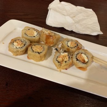 Sumo Hibachi & Sushi - UK Roll (I ate 1 piece before the photo and laid the pieces on their ends because it was hot.  Excuse my mess!) - Sushi Bars Near Me - Lexington, Kentucky