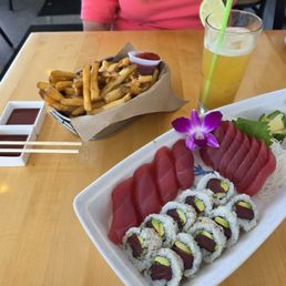 Tuna Sushi Boat, Mai Thai and a bucket of fries. Tuna Sushi Boat, Mai Thai and a bucket of fries.