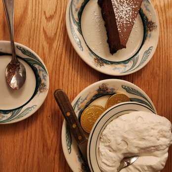 Peter Luger - Chocolate moose cake with home made whipped cream. Peter Luger chocolate gold coins. - Steakhouses Near Me - Brooklyn, New York