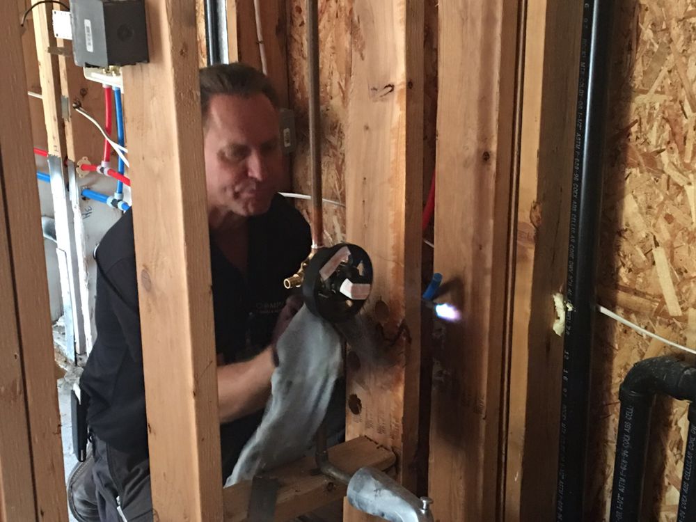 Slide of Compass Plumbing & Drain Services