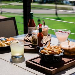 Hi-Fi Rooftop Bar - Savor happy hour bites and burgers at Hi-Fi Rooftop Bar at Fenway Hotel in Dunedin, Florida