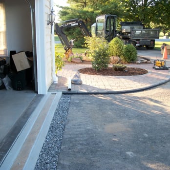 Montandon Services - Proper installation of "poly drain" drainage product in front of a garage. - Masonry/Concrete Near Me - York, Pennsylvania Montandon Services - Proper installation of "poly drain" drainage product in front of a garage. - Masonry/Concrete Near Me - York, Pennsylvania