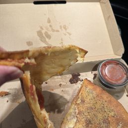 Pepperoni calzone. Not sure why there's no sauce inside. No cheese a total of 6 pepperonis and hard thin crust
