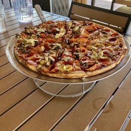 Large pepperoni mushroom and artichoke pizza