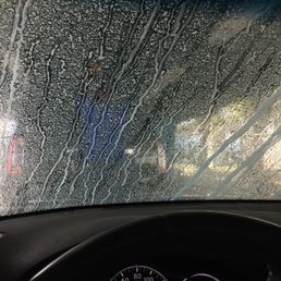 Sitting inside the car as they wash it Sitting inside the car as they wash it