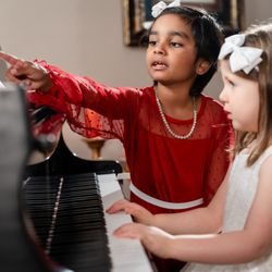 Renaissance Music Academy - Renaissance Music Academy students learning piano together