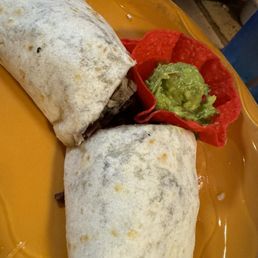 Medium beef brisket wrapped burro with black beans and a side of guacamole Medium beef brisket wrapped burro with black beans and a side of guacamole
