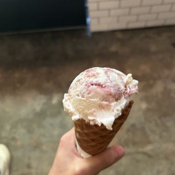 milk + sugar - Flavor: Strawberry Almond Cheesecake   Single Scoop, House-made waffle cone - Ice Cream & Frozen Yogurt Near Me - Houston, Texas