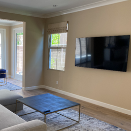 This wall had to be opened up to bring electricity to an outlet behind the TV, and now it looks brand new. This wall had to be opened up to bring electricity to an outlet behind the TV, and now it looks brand new.
