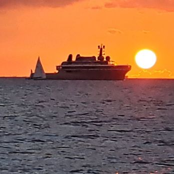 Waikiki Sailing Company - Mystery boat at sunset - Boating Near Me - Honolulu, Hawaii