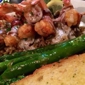 Cypress Grill - Shrimp en Brochette wrapped in jalapeños and bacon and grilled, served over dirty rice - American Near Me - Austin, Texas Cypress Grill - Shrimp en Brochette wrapped in jalapeños and bacon and grilled, served over dirty rice - American Near Me - Austin, Texas