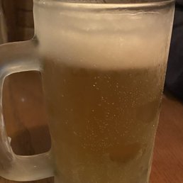 Cold beer in frosty mug Cold beer in frosty mug