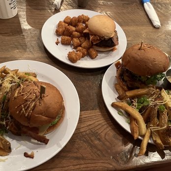 The Blue Duck - Left: Chicken Club w/ Bacon fat fries Top: *Slamburger - Kimchi Burger w/ Tots Right: Sam Elliot Burger w/ Bacon fat fries - Sandwiches Near Me - Maplewood, Missouri
