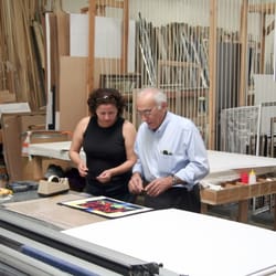 Pacific Custom Framing - Felix and Rosario discussing the design of a new piece.