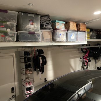 The Clever Home - garage rack storage overhead and off to the side - Home Organization Near Me