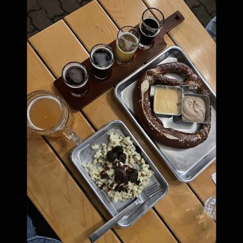 Gemüt Biergarten - a tray of beer and a pretzel - Beer Gardens Near Me - Columbus, Ohio