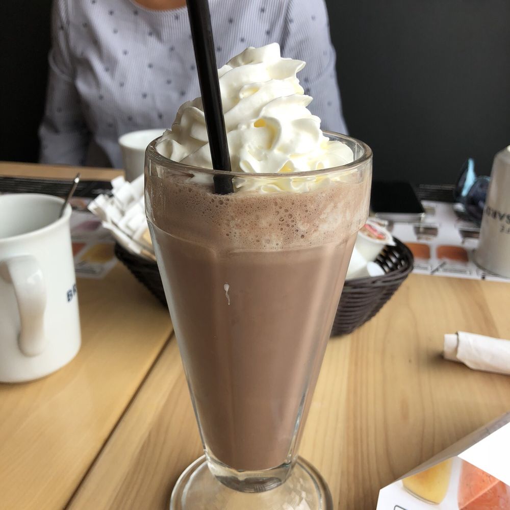 a chocolate milkshake with whipped cream
