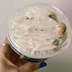 Top view of matcha smoothie, with their cute signature chocolate covered espresso bean!