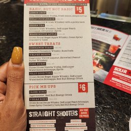  hand holding a menu