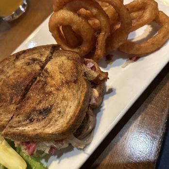 Pourhouse - Reuben with Onion Rings - Bars Near Me - Loveland, Colorado Pourhouse - Reuben with Onion Rings - Bars Near Me - Loveland, Colorado