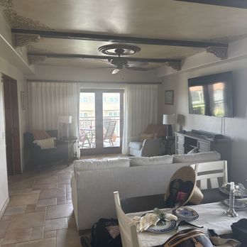 Ocean Lodge Resort - Living room dining area with view of balcony - Hotels Near Me - St Simons, Georgia