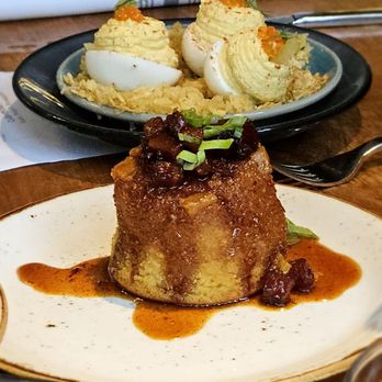 Meril - Deviled Eggs (background) Pineapple Upside Down Cornbread (foreground) - New American Near Me - New Orleans, Louisiana Meril - Deviled Eggs (background) Pineapple Upside Down Cornbread (foreground) - New American Near Me - New Orleans, Louisiana