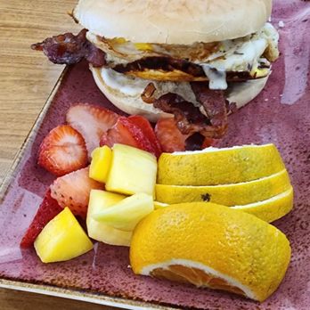 Magnolias Cafe - Bagel (bacon, eggs & cheese) served with fresh fruit 3 choices of bagel to choose from - Cafes Near Me - Goose Creek, South Carolina