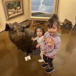My nieces next to some artwork in the gallery