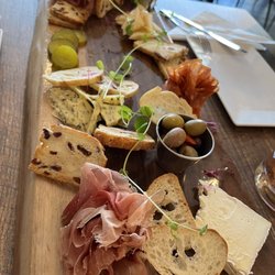 Cured Charcuterie & Cocktails - Charcuterie board with Brie, wild garlic Gouda, Parmesan with honey drizzle, speck, prosciutto, mild sopressata, and Portuguese chorizo