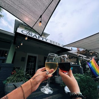 Crafty Beer Guys - two people toasting outside a crafty bar - Wine Bars Near Me - Huntersville, North Carolina Crafty Beer Guys - two people toasting outside a crafty bar - Wine Bars Near Me - Huntersville, North Carolina