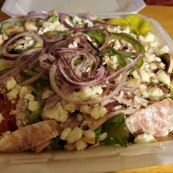 Guido's Pizza - To-go Greek salad with dressing added and no black abominations. Huge! - Pizza Near Me - Anchorage, Alaska