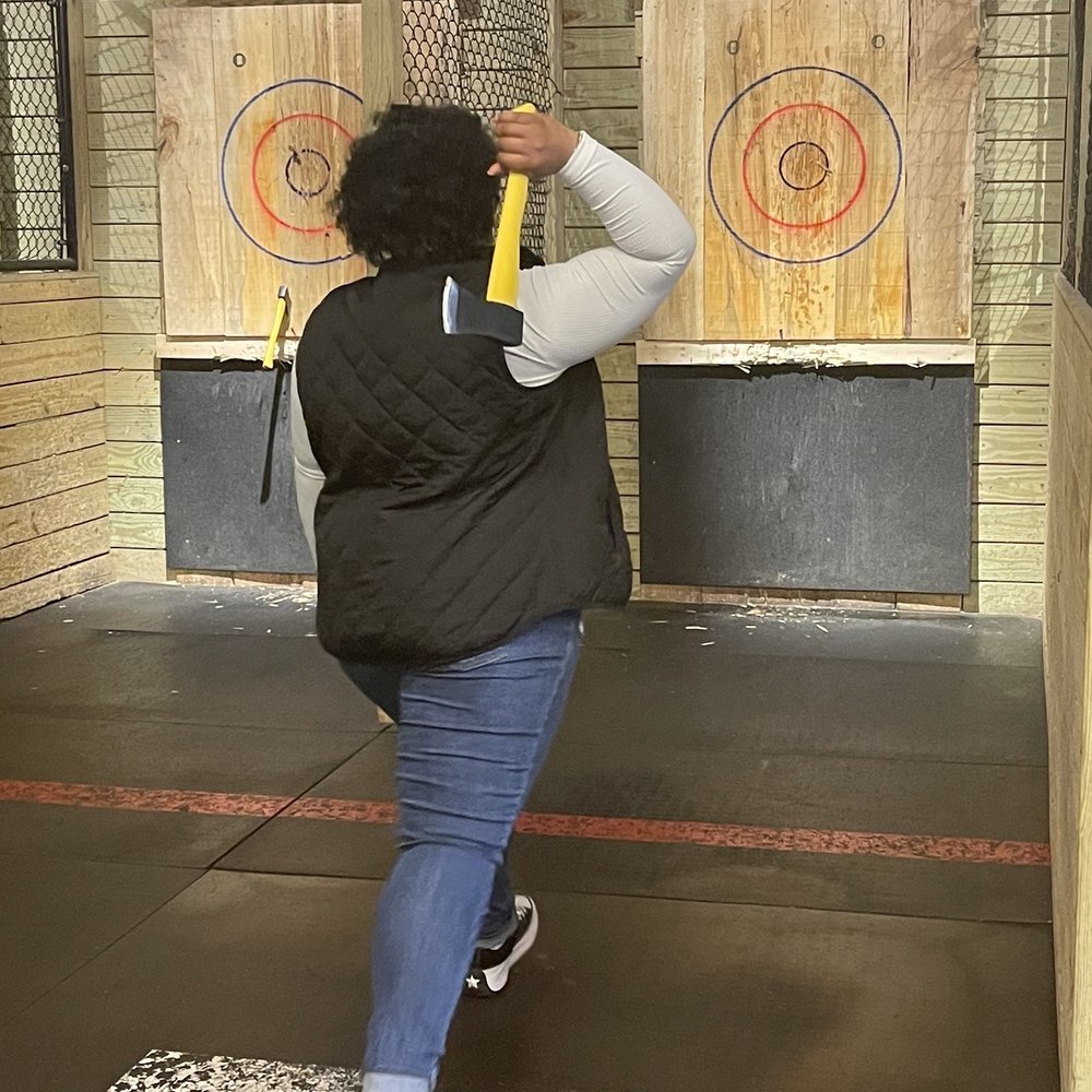 BATL Axe Throwing - a woman throwing a bat - Axe Throwing Near Me - Charlotte, North Carolina