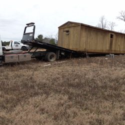 All In Towing - Taking time to make sure this heavy shed is level and well supported shows the expertise of this company.