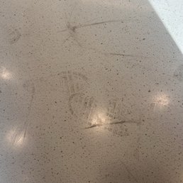 Table with child's shoe prints.