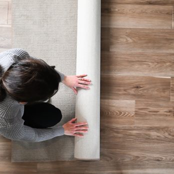 RiteRug Flooring & Carpet - Dublin - a woman rolling up a rug - Carpeting Near Me - Dublin, Ohio RiteRug Flooring & Carpet - Dublin - a woman rolling up a rug - Carpeting Near Me - Dublin, Ohio