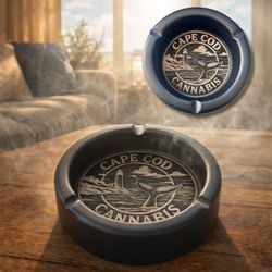 Cape Cod Cannabis - Crafted from durable stainless steel, this 4.8" matte-black ashtray features a precision-engraved Cape Cod lighthouse and whale tail design.