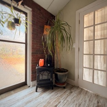 Heartspace - Corner of the studio with beautiful plants, window treatments, space heater, humidifier and lamps. Lots of natural light. - Yoga Near Me - Windsor, Connecticut Heartspace - Corner of the studio with beautiful plants, window treatments, space heater, humidifier and lamps. Lots of natural light. - Yoga Near Me - Windsor, Connecticut