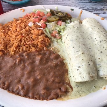 Chuy's - Deluxe enchilada - pretty good shredded chicken and sauce! Delicious! Great job on the refried beans too! - Tex-Mex Near Me - Cedar Park, Texas