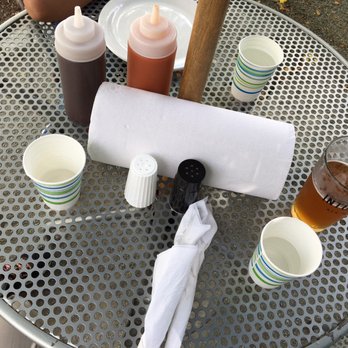 Mainely Meat - Outdoor table. Hot & BBQ sauces, salt and pepper, a very convenient kitchen paper roll. - Barbeque Near Me - Bar Harbor, Maine Mainely Meat - Outdoor table. Hot & BBQ sauces, salt and pepper, a very convenient kitchen paper roll. - Barbeque Near Me - Bar Harbor, Maine