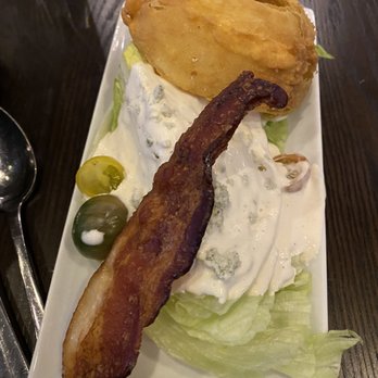 Rick Erwin's Level 10 - Half of the wedge salad. They split it for us! - New American Near Me - Spartanburg, South Carolina Rick Erwin's Level 10 - Half of the wedge salad. They split it for us! - New American Near Me - Spartanburg, South Carolina