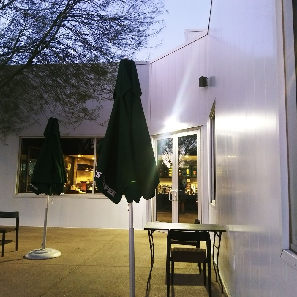 tables and umbrellas outside a coffee shop tables and umbrellas outside a coffee shop