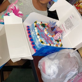 Baskin-Robbins - a young girl sitting at a table with a birthday cake in a box - Ice Cream & Frozen Yogurt Near Me - Fort Walton Beach, Florida Baskin-Robbins - a young girl sitting at a table with a birthday cake in a box - Ice Cream & Frozen Yogurt Near Me - Fort Walton Beach, Florida