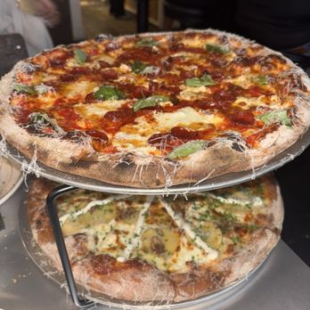Bird Pizzeria - Classic pizza with pepperoni (top), white pizza (bottom) - Pizza Near Me - Charlotte, North Carolina Bird Pizzeria - Classic pizza with pepperoni (top), white pizza (bottom) - Pizza Near Me - Charlotte, North Carolina