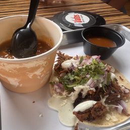Birria Taco and a "side" of Green Chili. Birria Taco and a "side" of Green Chili.