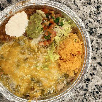 New Mexican Kitchen - Green chile chicken enchiladas with cheese, rice, beans, lettuce, pico, guacamole, and sour cream. - New Mexican Cuisine Near Me - Georgetown, Texas New Mexican Kitchen - Green chile chicken enchiladas with cheese, rice, beans, lettuce, pico, guacamole, and sour cream. - New Mexican Cuisine Near Me - Georgetown, Texas