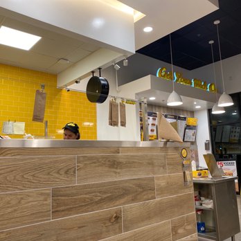 Which Wich - a man at a counter in a fast food restaurant - Sandwiches Near Me - Pooler, Georgia